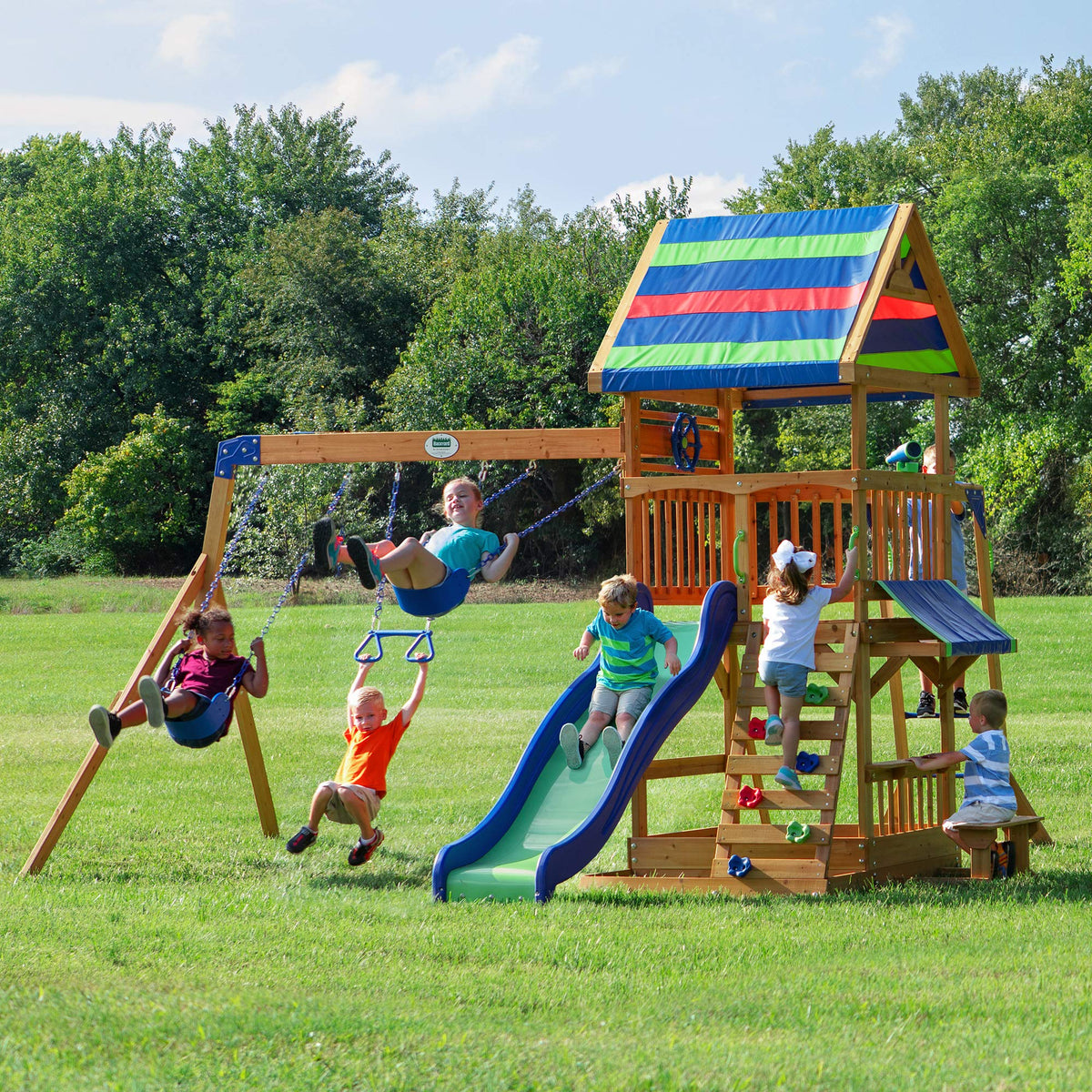 Backyard Discovery Beach Front Cedar Wood Swing Set with Wave Slide, Play Deck, Monkey Bars, Rock Wall Ladder, Shaded Picnic Area, Snack Bar, Belt Swings, Trapeze, Sandbox Area, Outdoor Playset